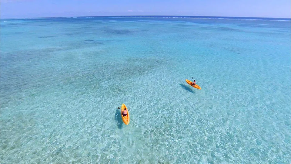 Poolside cabanas and palm trees at Las Terrazas resort
